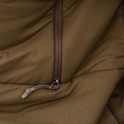 The close-up view of the front zipper found on the Stone Glacier Cirque Jacket in muskeg.