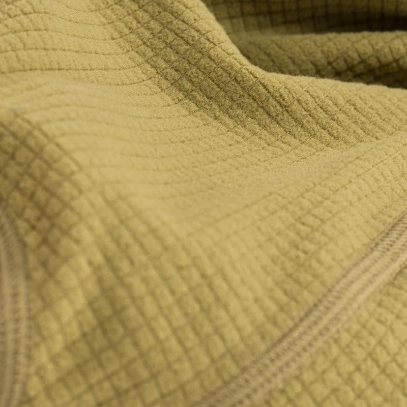 A close-up view of the grid fleece found on the Stone Glacier Helio Hoody in coyote.