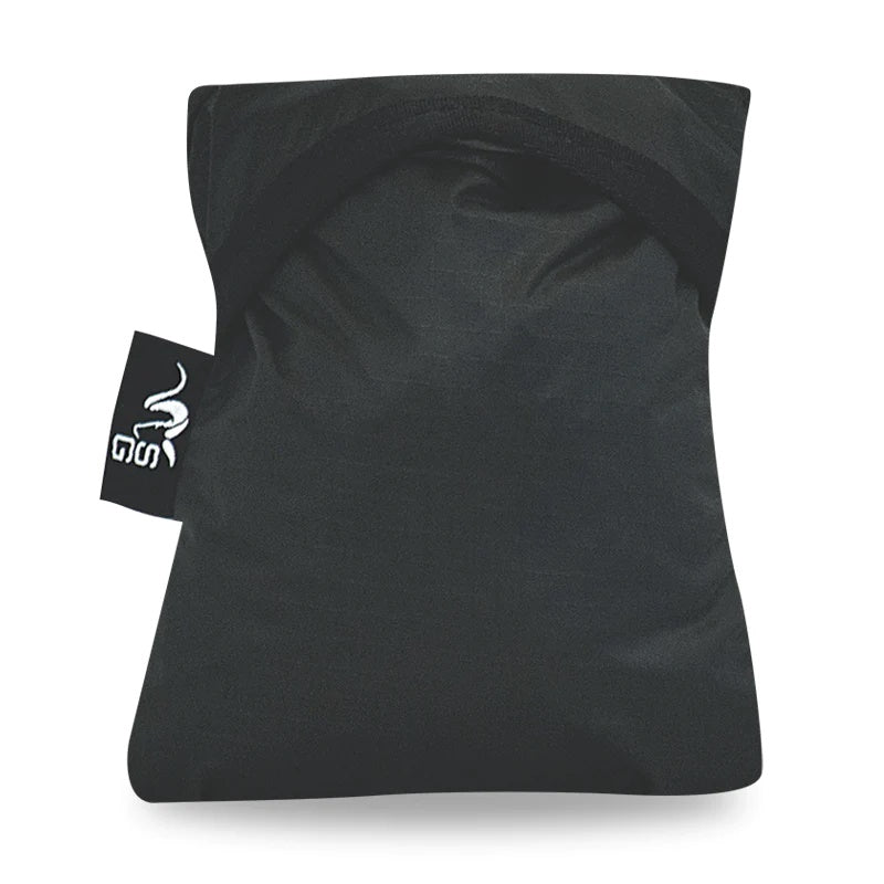 The Stone Glacier Rain Cover fully compressed and stored in its stuff sack for storage.
