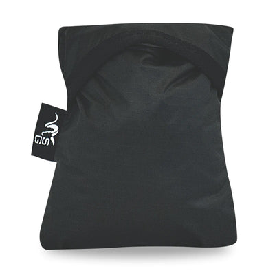 The Stone Glacier Rain Cover fully compressed and stored in its stuff sack for storage.