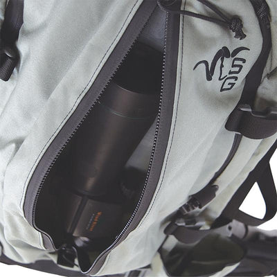 The outer-facing, zippered pocket of the Stone Glacier Sky 5900 Backpack with the zipper undone and a spotting scope positioned within.
