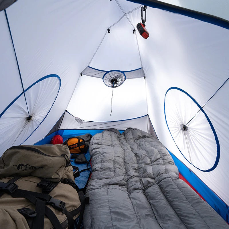 A view looking into the Stone Glacier Sky Solus 1P Tent with a backpack and sleeping bag within.